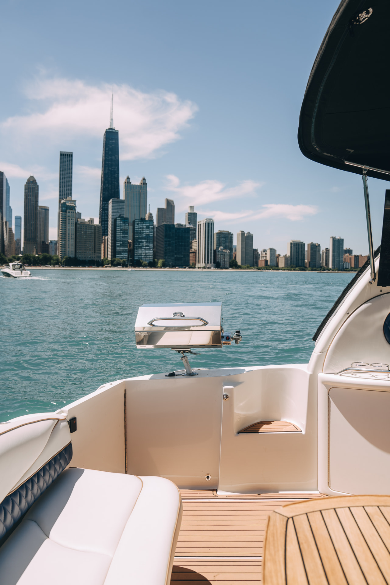Grill and seating on Soulshine's aft deck with the Chicago skyline across the water