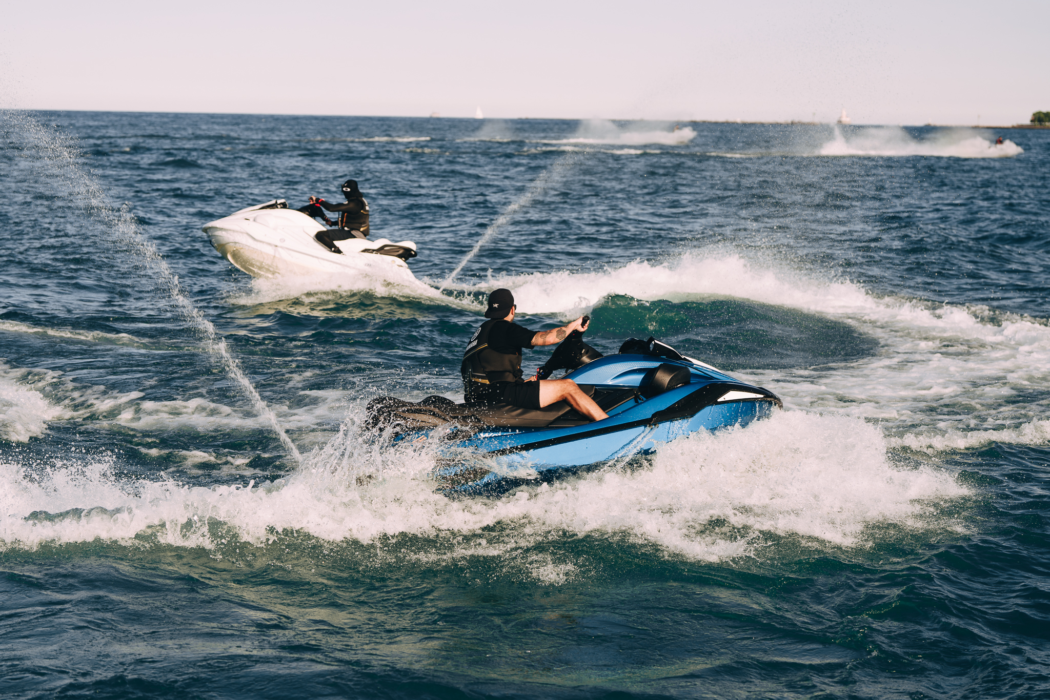 Blue Yamaha FX Cruiser wave runner cutting across the water